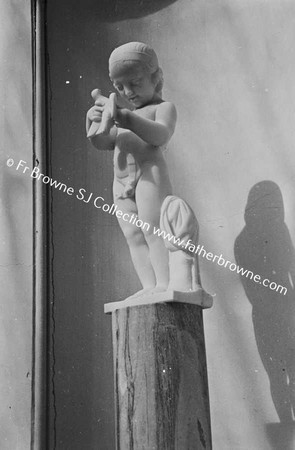IN THE SULPTURE GALLERY BOY WITH BIRD